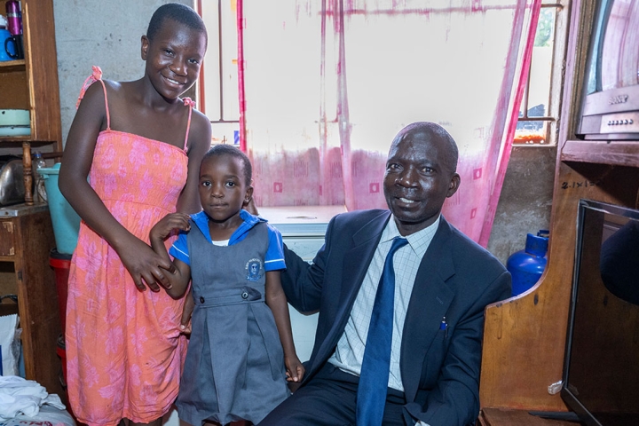 Mercy, Talent, and Mandigaisa inside their home