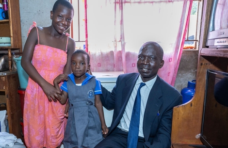 Mercy, Talent, and Mandigaisa inside their home